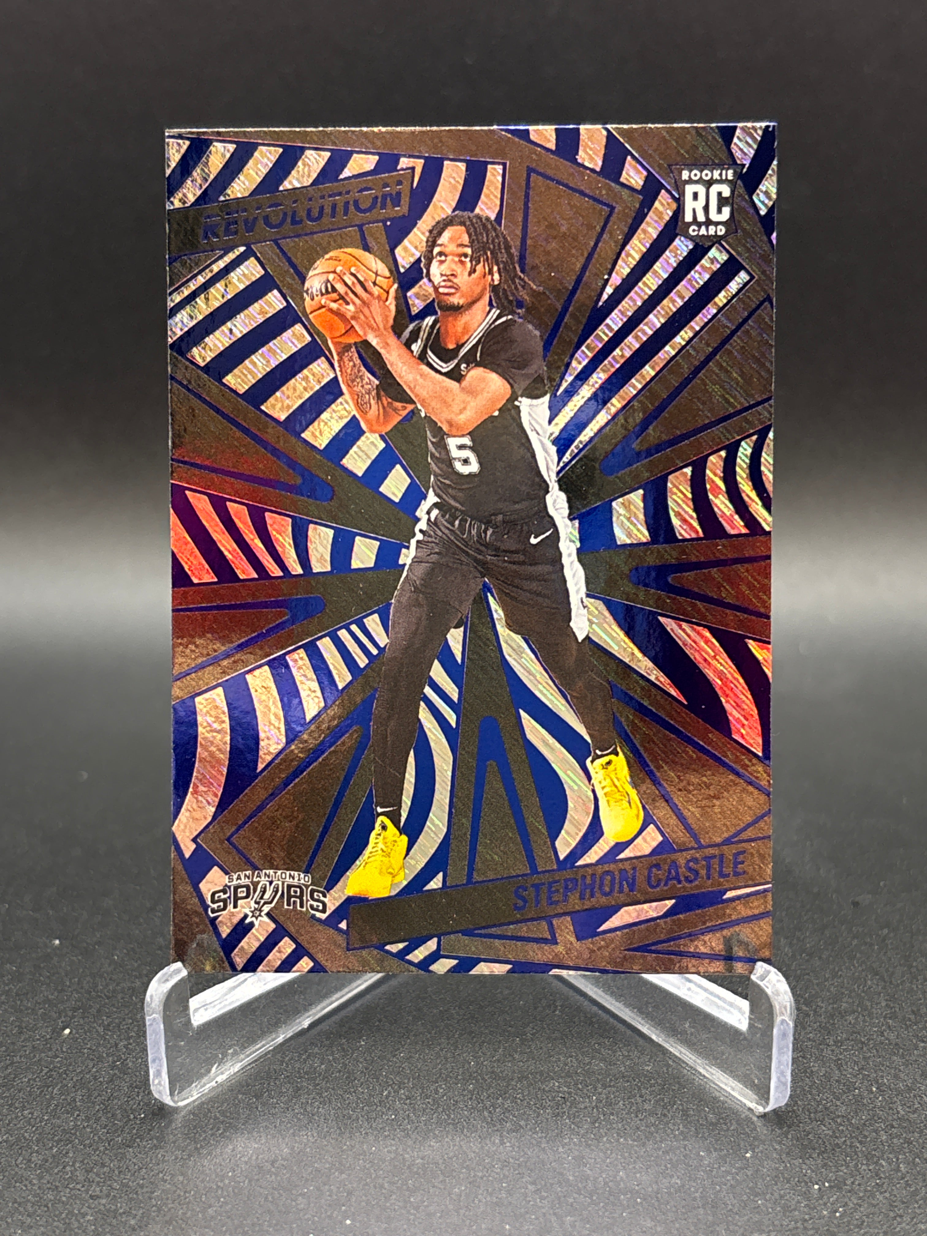 2024-25 Revolution Rookies Stephon Castle #116 Blue Storm RC SAN ANTONIO SPURS